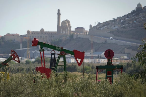 A pumpjack operates in Baku, Azerbaijan, Monday, Sept. 16, 2024. (AP Photo/Sergei Grits)