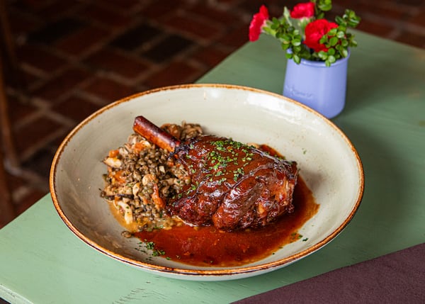 Chef Derek Larsen's recipe for the braised lamb shank served at Anis Cafe & Bistro uses a classic French braising method and French flavorings. (Aaliyah Man for The Atlanta Journal-Constitution / Food styling by Derek Larsen)