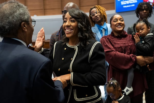 Commissioner Mo Ivory is sworn in at the Fulton County Government Center Assembly Hall in Atlanta, Georgia on Friday, Jan. 3, 2025. (Olivia Bowdoin for the AJC). 