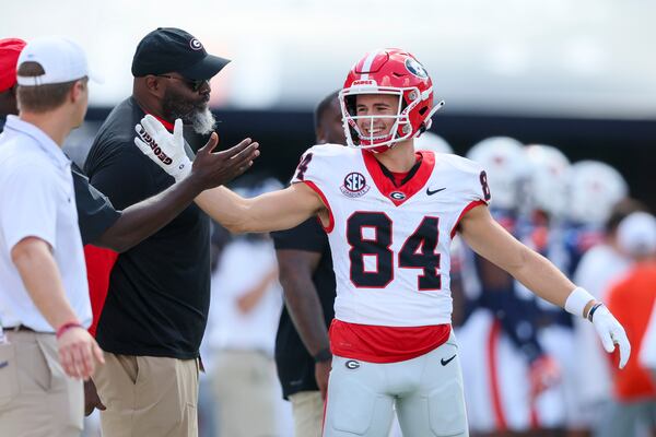 Georgia wide receiver Ladd McConkey (84) greets staff members before Georgia’s game against Auburn at Jordan-Hare Stadium, Saturday, September 30, 2023, in Auburn, Al.  (Jason Getz / Jason.Getz@ajc.com)