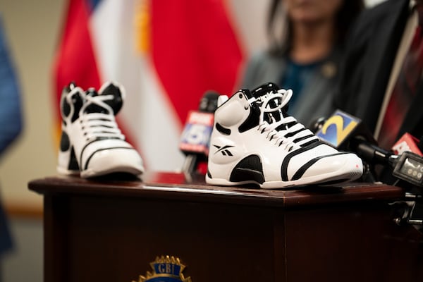 Unique shoes worn by the suspect are displayed at Tuesday's news conference.