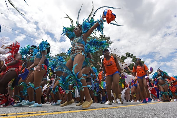 Participants in last year’s Atlanta Caribbean Carnival Parade. HYOSUB SHIN / HSHIN@AJC.COM