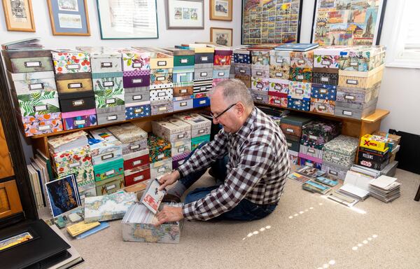 Joe Vella doesn’t display any of his postcards but files them alphabetically by country and state in photo boxes. Each card lives inside its own poly sleeve, and he keeps track of what he has with an Excel spreadsheet. PHIL SKINNER FOR THE ATLANTA JOURNAL-CONSTITUTION