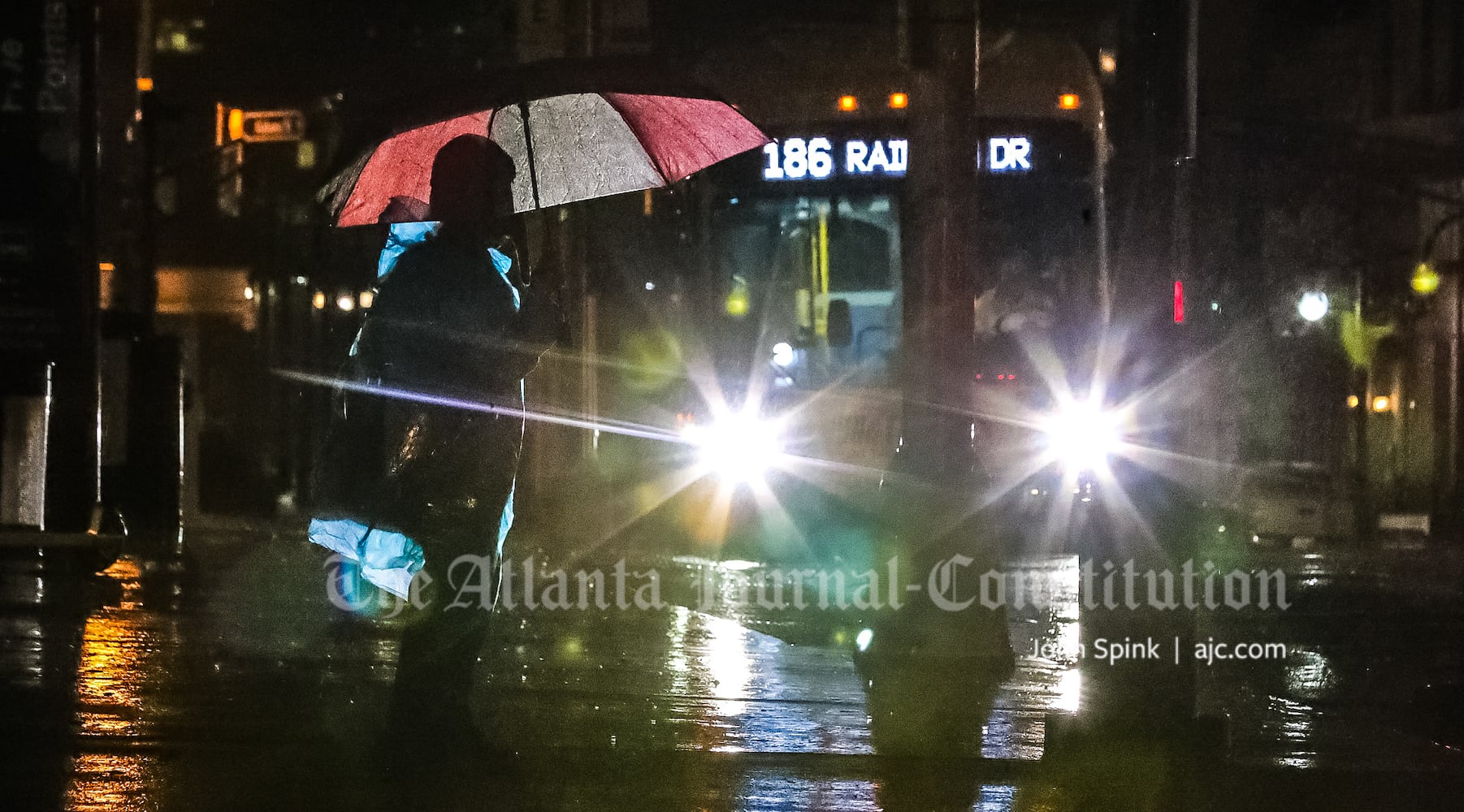 Glenn Gilley waits for a bus on Alabama Street downtown