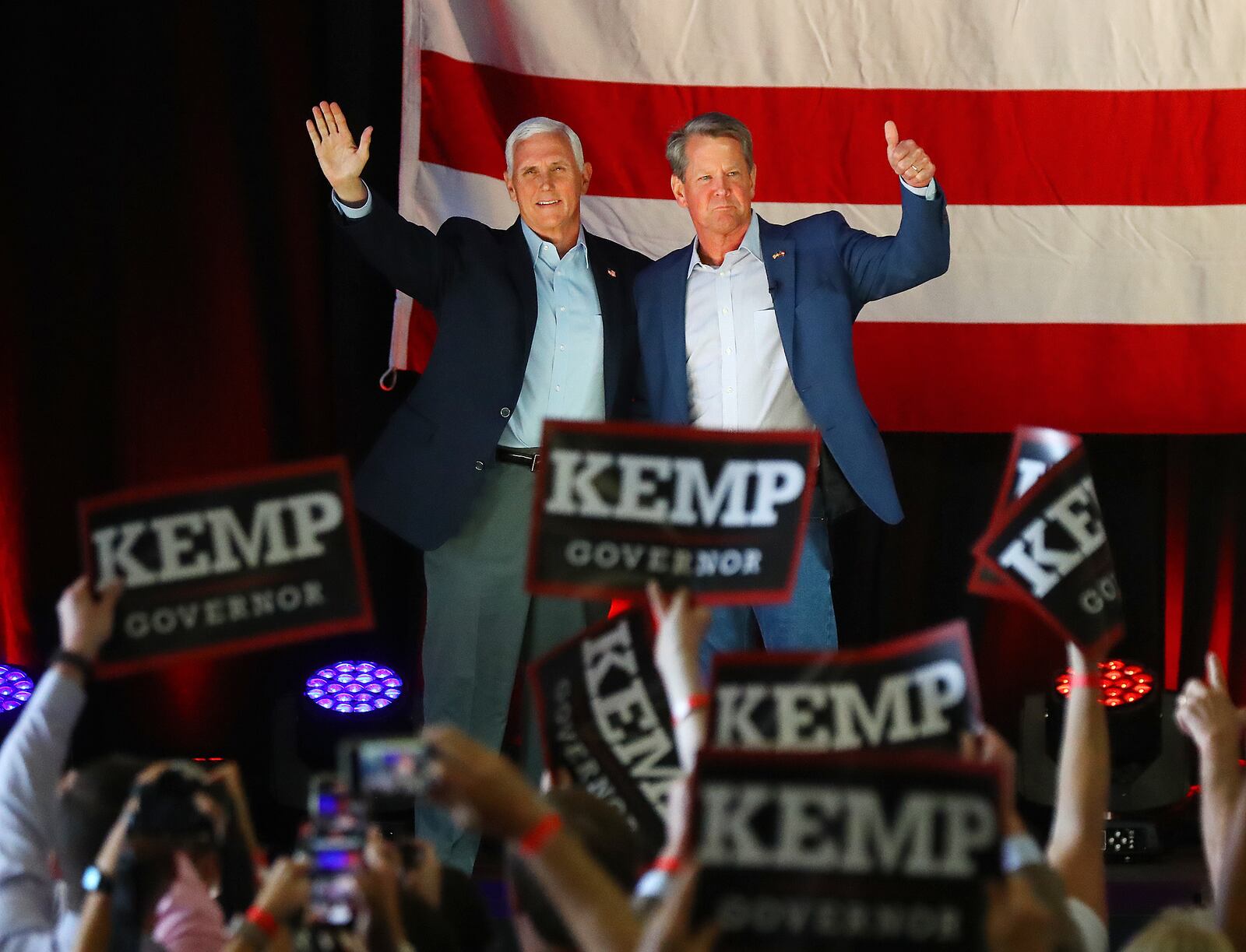 Former Vice President Mike Pence will be back in Georgia next month to raise money for four GOP contenders. He is pictured at a rally with Gov. Brian Kemp on May 23, 2022, in Kennesaw.  (Curtis Compton / AJC)