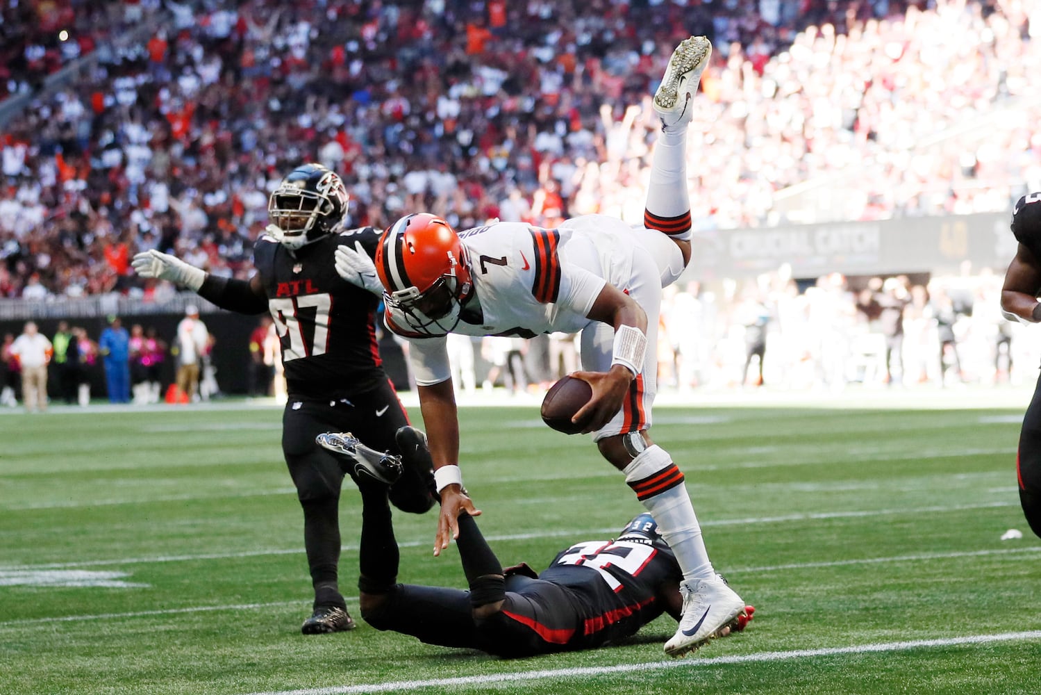 Browns quarterback Jacoby Brissett goes airborne as he crosses the goal line during the second quarter against the Falcons on Sunday in Atlanta. (Miguel Martinez / miguel.martinezjimenez@ajc.com)