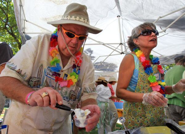 Jack McGinnis and Gloria Ormand of the Roswell Presbyterian Church had plenty of fruity flavors to choose from at the Maui Jack Ice Cream Bar booth at the Miss Mary's Ice Cream Crankin fundraiser for The Drake House on the Historic Roswell Town Square, Sunday, August 28, 2011. For $5 individual and $15 family attendees were treated to all the ice cream they could eat with more than 100 flavors to sample from.