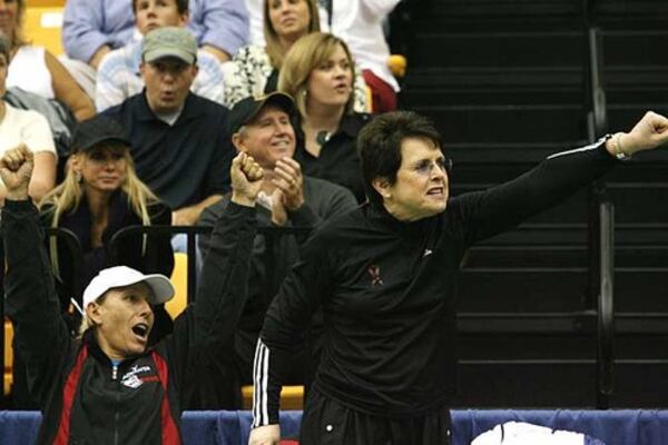 Martina Navratilova (left) and Billie Jean King cheer on Jesse Levine for team Billie Jean King during a singles match against Andy Roddick.