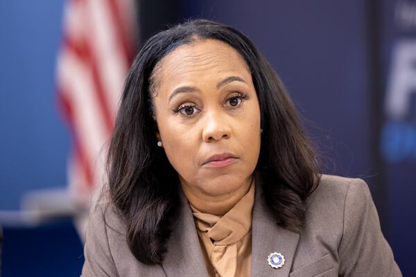 Fulton County District Attorney Fani Willis listens during a press interview at the district attorney’s office in Atlanta on Friday, July 12, 2024. Public safety officials presented findings from a report on repeat offenders. (Arvin Temkar / AJC)