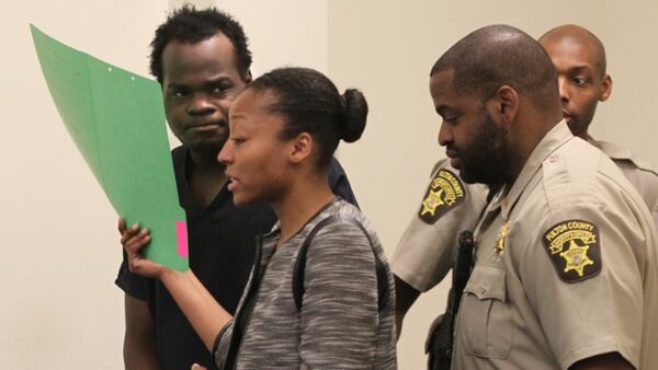 Basil Eleby is escorted by his public defender and two Fulton County Sheriff's office officers into the courtroom of presiding Judge James Altman at the Fulton County Jail in Atlanta on April 1, 2017. (HENRY TAYLOR / HENRY.TAYLOR@AJC.COM)