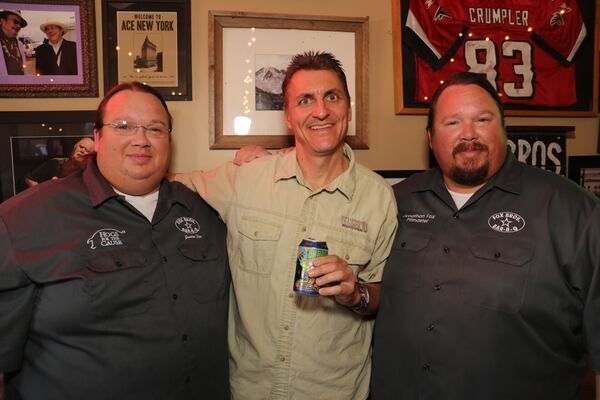  Twin brothers Justin and Jonathan Fox with Terrapin's Brian "Spike" Bukowski at Fox Bros. Bar-B-Q in Atlanta. / Credit: Reid Ramsay.