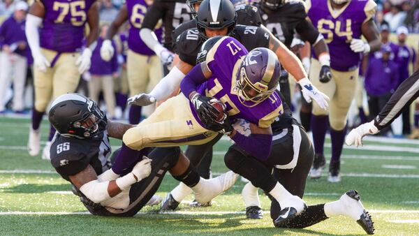 Atlanta Legends' James Quick is tackled by Birmingham Iron's  Beniquez Brown Sunday, Feb. 24, 2019, at Georgia State Stadium in Atlanta. The Legends fell, 28-12, in their home opener.