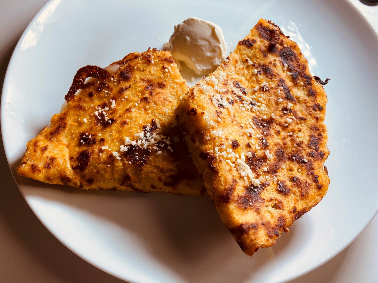 The Venezuelan cachapa is a sweet corn pancake with cheese. Bob Townsend for The Atlanta Journal Constitution