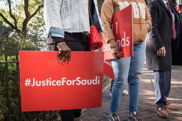 Attendees hold signs in support of the Lee family as William Claiborne, attorney for the family of Saudi Lee, speaks at a press conference, on December 4, 2024, in Savannah, GA. (Courtesy of Justin Taylor/The Current GA)