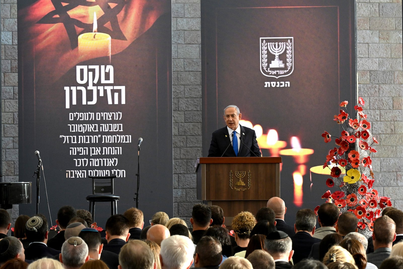 Israeli Prime Minister Benjamin Netanyahu speaks at a memorial ceremony for those killed by Hamas on Oct. 7, 2023, and those who fell in the "Iron Sword" war, at the Knesset, the Parliament, in Jerusalem, Monday, Oct. 28, 2024. (Debbie Hill, Pool Photo via AP)