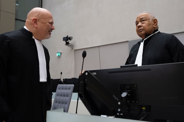 Duterte's lawyer Salvador Medialdea, right, talks to Chief Prosecutor Karim Khan, left, before former Philippine President Rodrigo Duterte appeared via video link before the International Criminal Court (ICC) in The Hague, Netherlands, Friday, March 14, 2025. (AP Photo/Peter Dejong, Pool)