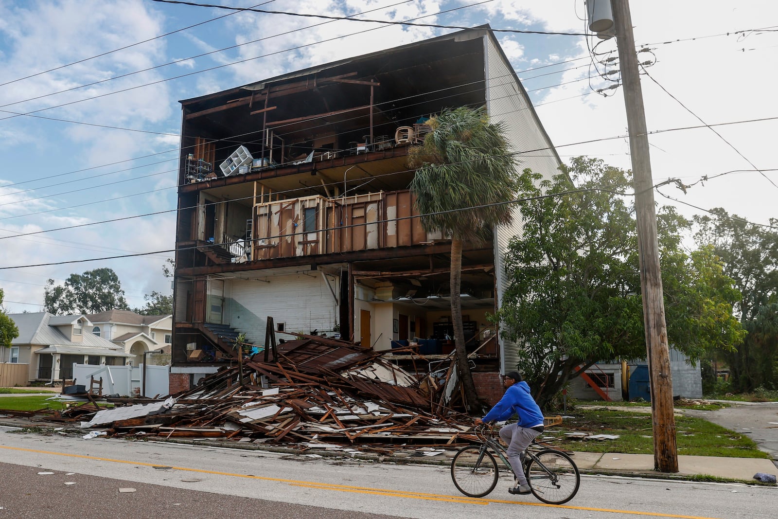 A building loses its front side around the Palmetto Beach neighborhood after Hurricane Milton on Thursday, Oct. 10, 2024, in Tampa, Fla. (Jefferee Woo/Tampa Bay Times via AP)