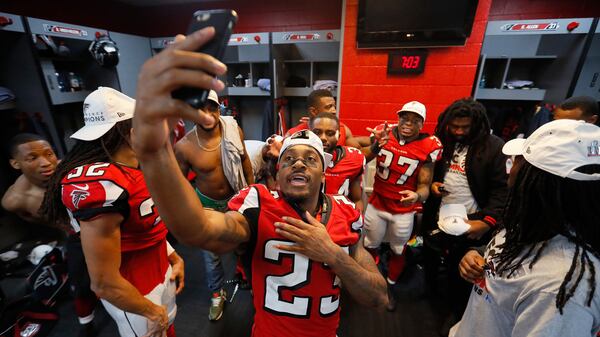  Robert Alford (23) celebrates with teammates in the locker room after defeating the Green Bay Packers in the NFC Championship Game at the Georgia Dome on January 22, 2017 in Atlanta. The Falcons defeated the Packers 44-21. (Kevin C. Cox/Getty Images)