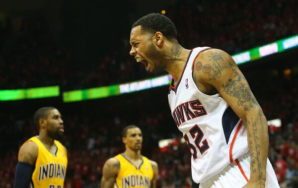 050114 ATLANTA: Hawks Mike Scott reacts after slamming for two points against the Pacers during the second half of their First Round Game 6 contest on Thursday, May 1, 2014, in Atlanta. CURTIS COMPTON / CCOMPTON@AJC.COM