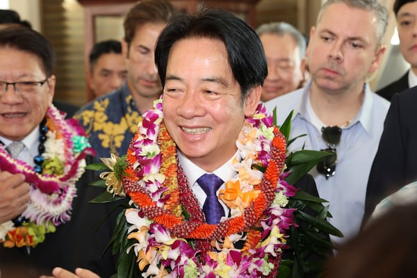 Taiwan President Lai Ching-te greets people at the Kahala Hotel and Resort Saturday, Nov. 30, 2024 in Honolulu. (AP Photo/Marco Garcia)