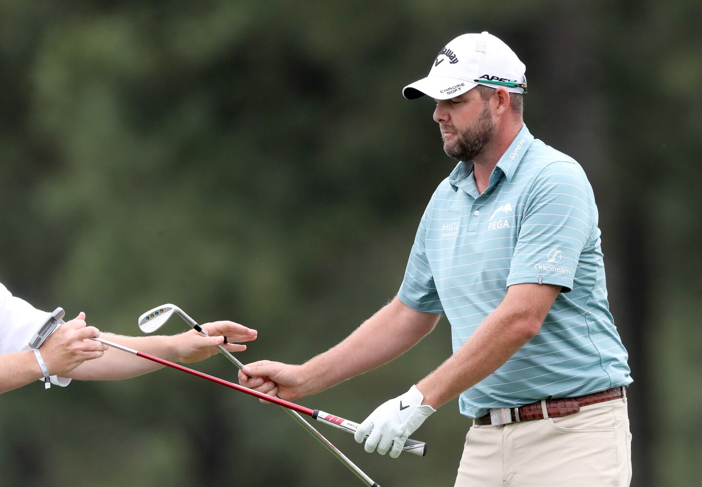 April 9, 2021, Augusta: Marc Leishman receives his putter from his caddie on the seventeenth green during the second round of the Masters at Augusta National Golf Club on Friday, April 9, 2021, in Augusta. Curtis Compton/ccompton@ajc.com