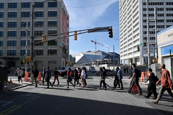 Attendees participate in walking tour of South Downtown lead by Jon Birdsong and April Stammel, Tuesday, March 12, 2024, in Atlanta. (Hyosub Shin / Hyosub.Shin@ajc.com)