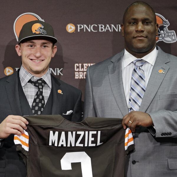 Johnny Manziel and Cleveland general manager Ray Farmer after the draft. (Tony Dejak/Associated Press)