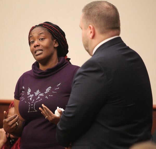 Standing with District Attorney Brian Fortner, Hyesha Bryant stands and speaks to Kayla Norton and the court in response to Norton’s statement to the court. Bryant told of how she had to teach her child the meaning of “hate” after the episode. But she went on to say she forgave Norton and her crimes. (Henry Taylor / henry.taylor@ajc.com)