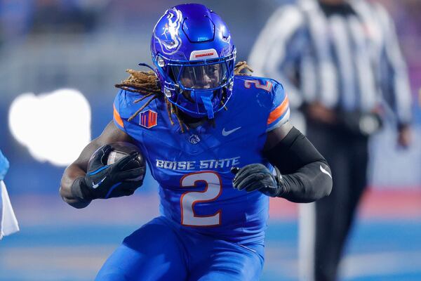 Boise State running back Ashton Jeanty (2) runs with the ball against UNLV in the first half of the Mountain West Championship NCAA college football game Friday, Dec. 6, 2024, in Boise, Idaho. (AP Photo/Steve Conner)