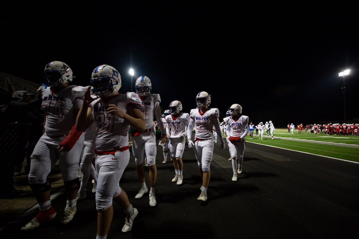 Walton players leave the field after a GHSA high school football playoff game between the Archer Tigers and the Walton Raiders at Archer High School in Lawrenceville, GA., on Friday, November 19, 2021. (Photo/Jenn Finch)