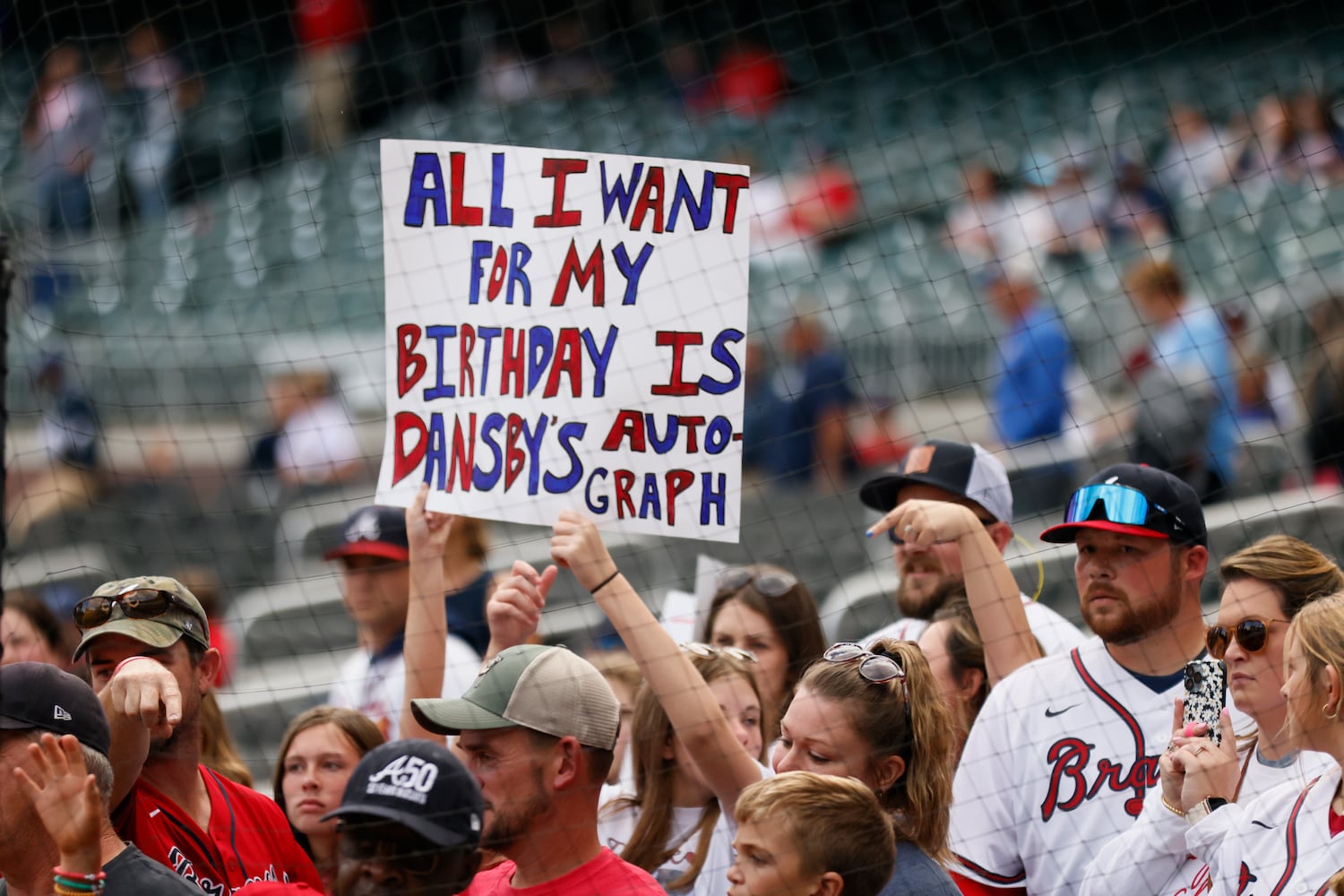 A Braves fan had a special request before the second game of the series between the Atlanta Braves and the New York Mets at Truist Park on Saturday, Oct. 1, 2022. Miguel Martinez / miguel.martinezjimenez@ajc.com 