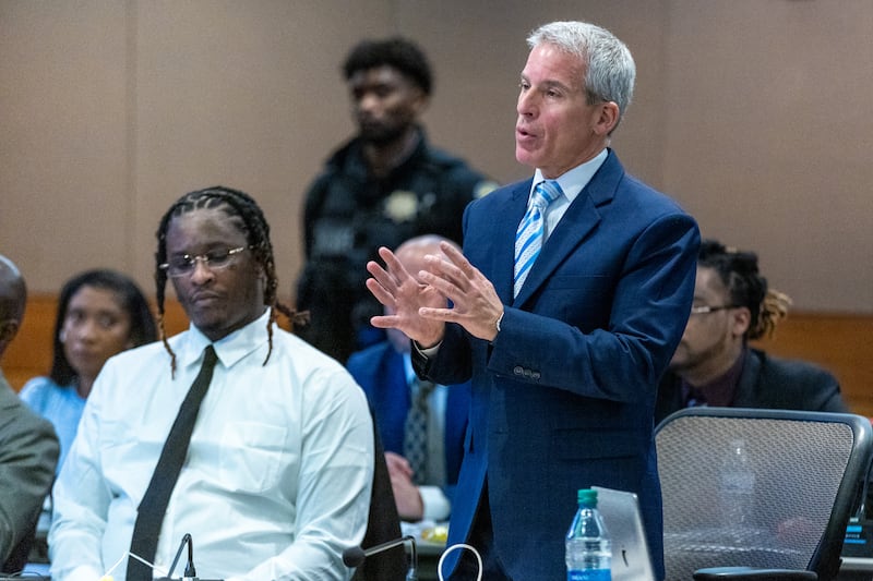 Defense attorney Brian Steel talks with the judge during opening statements in the YSL trial at Fulton County Courthouse on Monday, November. 27, 2023. (Steve Schaefer/steve.schaefer@ajc.com).