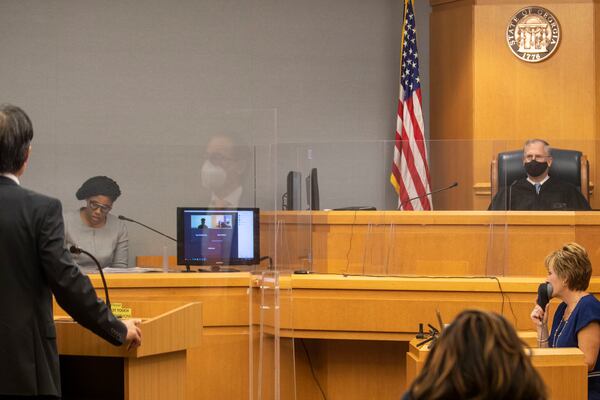 08/24/2020 - Lawrenceville, Georgia - Gwinnett County Chief Judge George F. Hutchinson III (right) presides over a virtual court case conducted in his courtroom at the Gwinnett Justice and Administration Center in Lawrenceville, Monday, August 24, 2020.The cases were conducted over Zoom. (ALYSSA POINTER / ALYSSA.POINTER@AJC.COM)