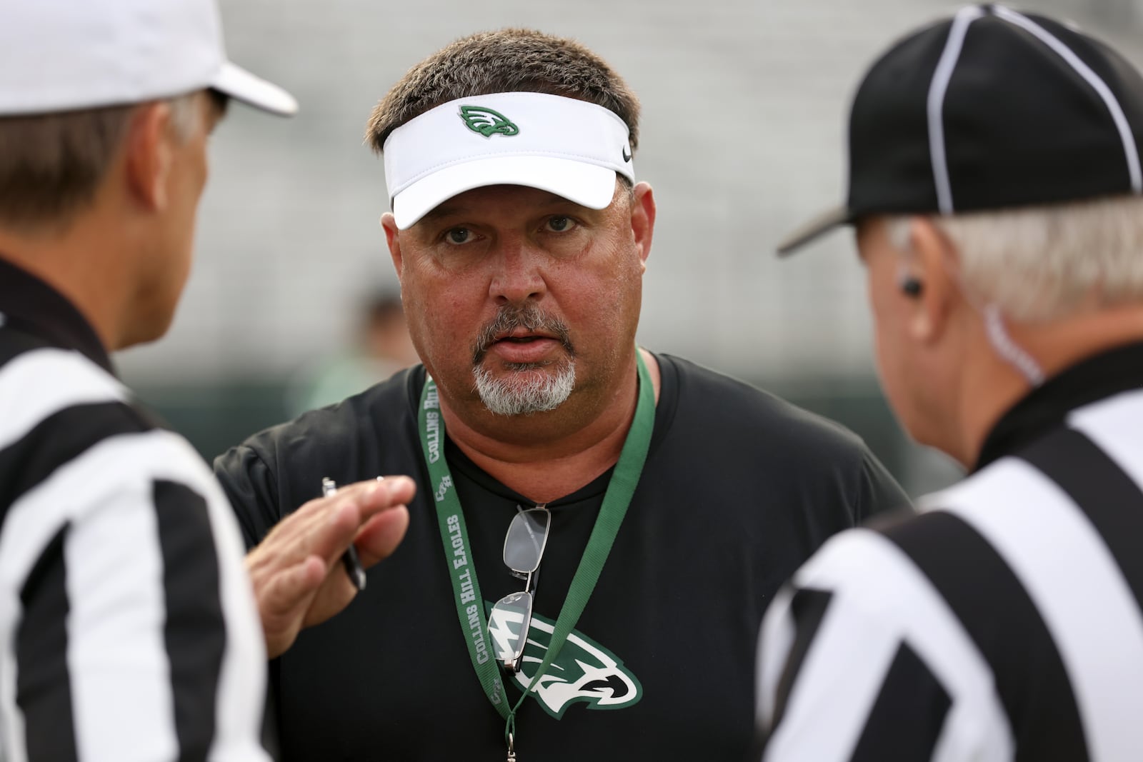 Collins Hill head coach Lenny Gregory talks with officials before their game against Cedar Grove at Collins Hill High School, Friday, September 9, 2022, in Suwanee. Cedar Grove won 40-6. (Jason Getz / Jason.Getz@ajc.com)