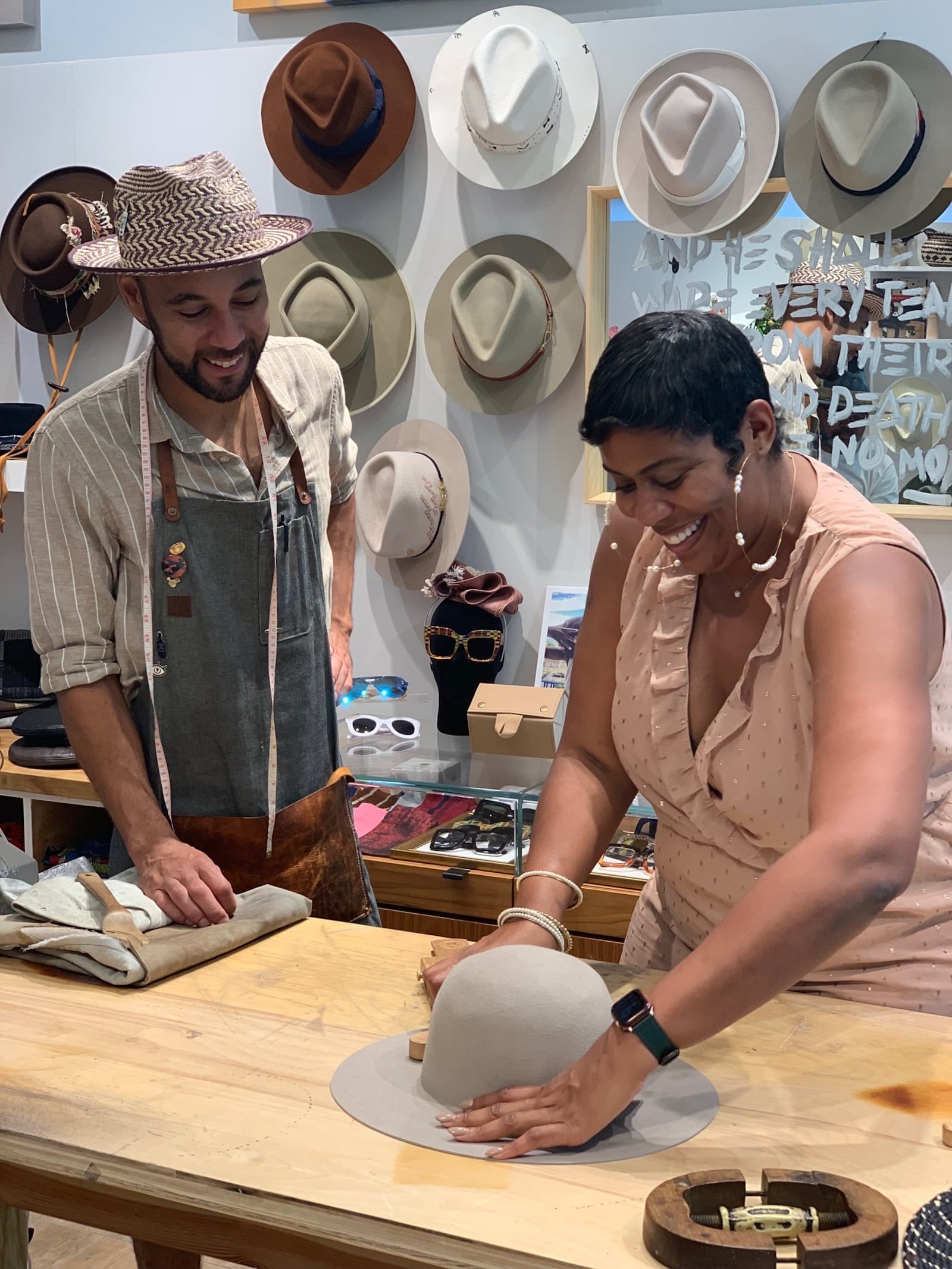 Ronnetta Barrett-Young tries her skills at hat making at a class at B.M. Franklin & Co. Photo: Mary Welch for AJC