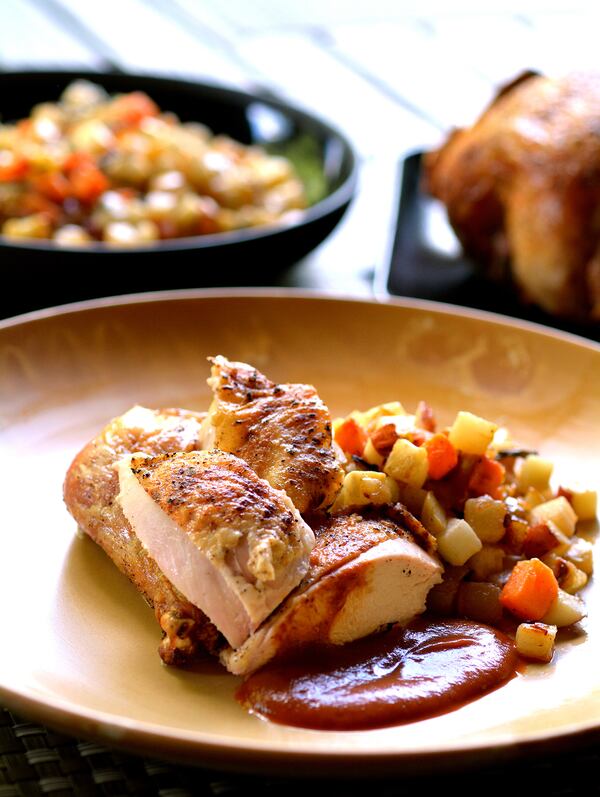 Canoe executive chef Matt Basford mixed his home life and his restaurant skills in creating Whole Roasted Chicken with Celery Root Pear "Hash" and Cranberry BBQ Sauce. Courtesy of Jeff Moore / Green Olive Media