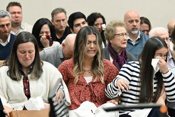 Family members and friends of Laken Riley react as Superior Court Judge H. Patrick Haggard announces the verdict during a trial of Jose Ibarra at Athens-Clarke County Superior Court, Wednesday, Nov. 20, 2024, in Athens, Ga. (Hyosub Shin/Atlanta Journal-Constitution via AP, Pool)