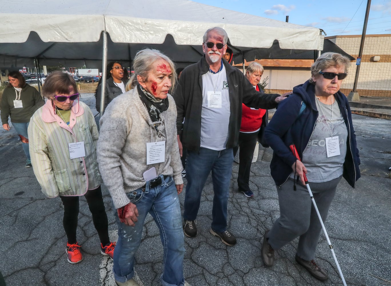 About 50 people volunteered to act as victms  in realistic disaster scenarios and scenes during the emergency preparedness training session Thursday, Oct. 19, 2023. (John Spink / John.Spink@ajc.com) 

