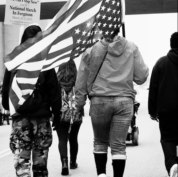 This image from the #1960 Now series by Atlanta photographer Sheila Pree Bright. She captured it during the national march on Ferguson, 'We Can't Stop Now,' protesting police violence and the murder of Mike Brown, 2015.