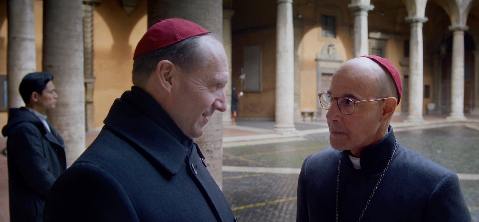 This image released by Focus Features shows Ralph Fiennes and Stanley Tucci, right, in a scene from "Conclave." (Focus Features via AP)