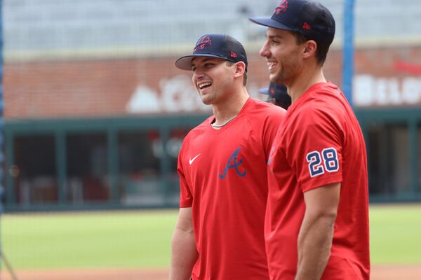 Braves' third baseman Austin Riley and first baseman Matt Olson share some time during the warm-up at Truist Park.Tuesday, April 12, 2022. Miguel Martinez/miguel.martinezjimenez@ajc.com