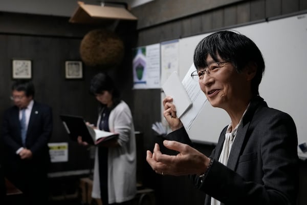 Nami Goto, managing director of Research and Development for the Brewing Society of Japan, speaks during a media tour at Ozawa Sake Brewery in Ome, on the western outskirts of Tokyo, Japan, Wednesday, Nov. 13, 2024. (AP Photo/Hiro Komae)