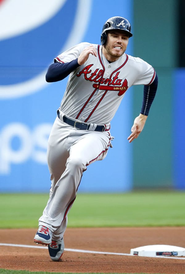 Freddie Freeman rounds third en route to scoring on a double off the bat of Nick Markakis against the Cleveland Indians April 21, 2019, at Progressive Field.