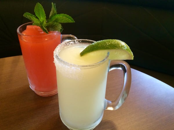 Two frozen drink machines will dispense drinks that include a classic frozen margarita (foreground) and a frozen strawberry daiquiri called Little Havana (background). Photo by Ligaya Figueras