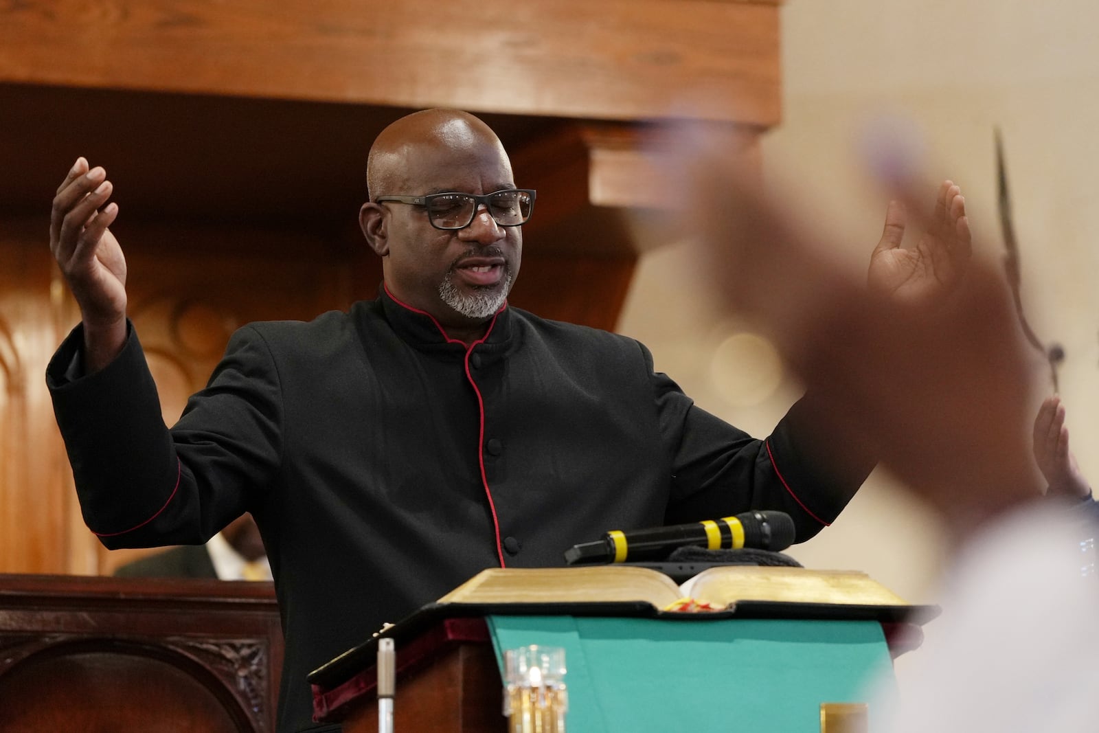 Mother Bethel AME Church senior pastor, the Rev. Mark Tyler, leads a service in Philadelphia, on Sunday, Sept. 29, 2024. (AP Photo/Luis Andres Henao)