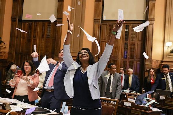 State Rep. Carolyn Hugley, D-Columbus, tosses paper in the air at the conclusion of the legislative session in 2023. On Thursday, state House Democrats voted to make her the minority leader. (Natrice Miller/The Atlanta Journal-Constitution/TNS)