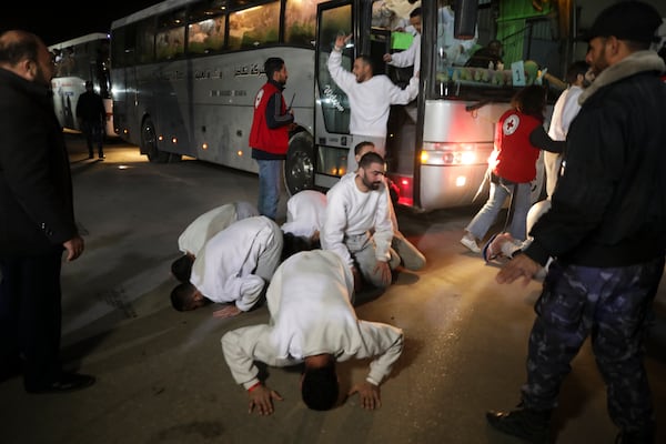 Freed Palestinian prisoners react as they arrive in the Gaza Strip after being released from an Israeli prison following a ceasefire agreement between Hamas and Israel in Khan Younis, Gaza Strip, Thursday, Feb. 27, 2025. (AP Photo/Jehad Alshrafi)