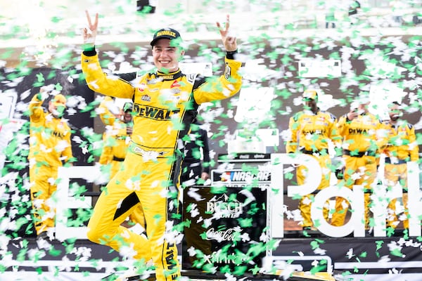 Christopher Bell celebrates after his win in a NASCAR Cup Series auto race at Circuit of the Americas in Austin, Texas, Sunday, March 2, 2025. (AP Photo/Stephen Spillman)