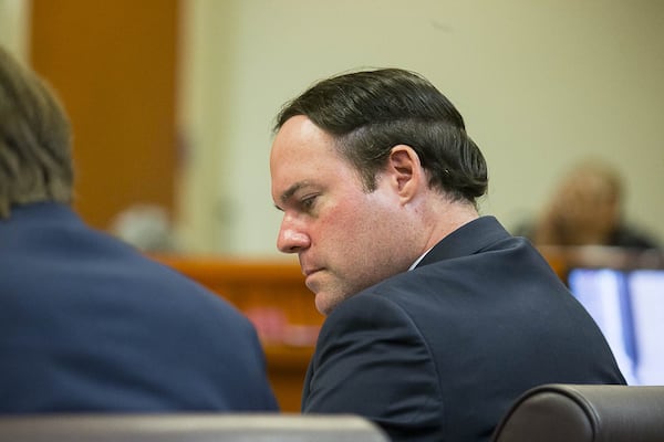 Georgia Department of Revenue attorney Alex Sponseller sits with his team in the courtroom of Judge Alan C. Harvey at the DeKalb County Courthouse in Decatur. (ALYSSA POINTER/ALYSSA.POINTER@AJC.COM) AJC FILE PHOTO