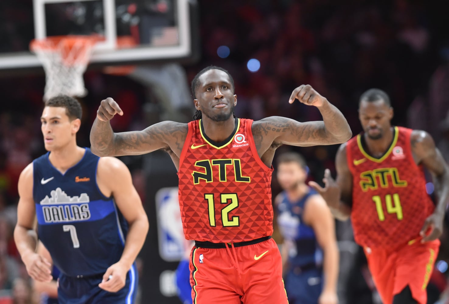 Photos: Hawks rally to beat Mavs in home opener